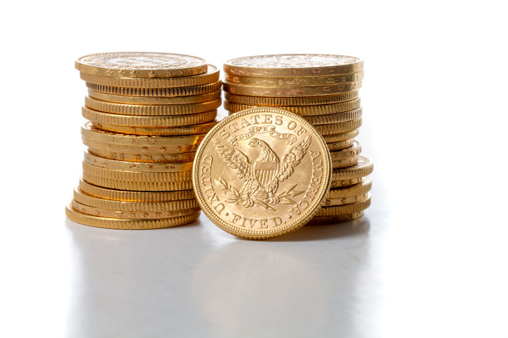 stack of gold american eagle coins